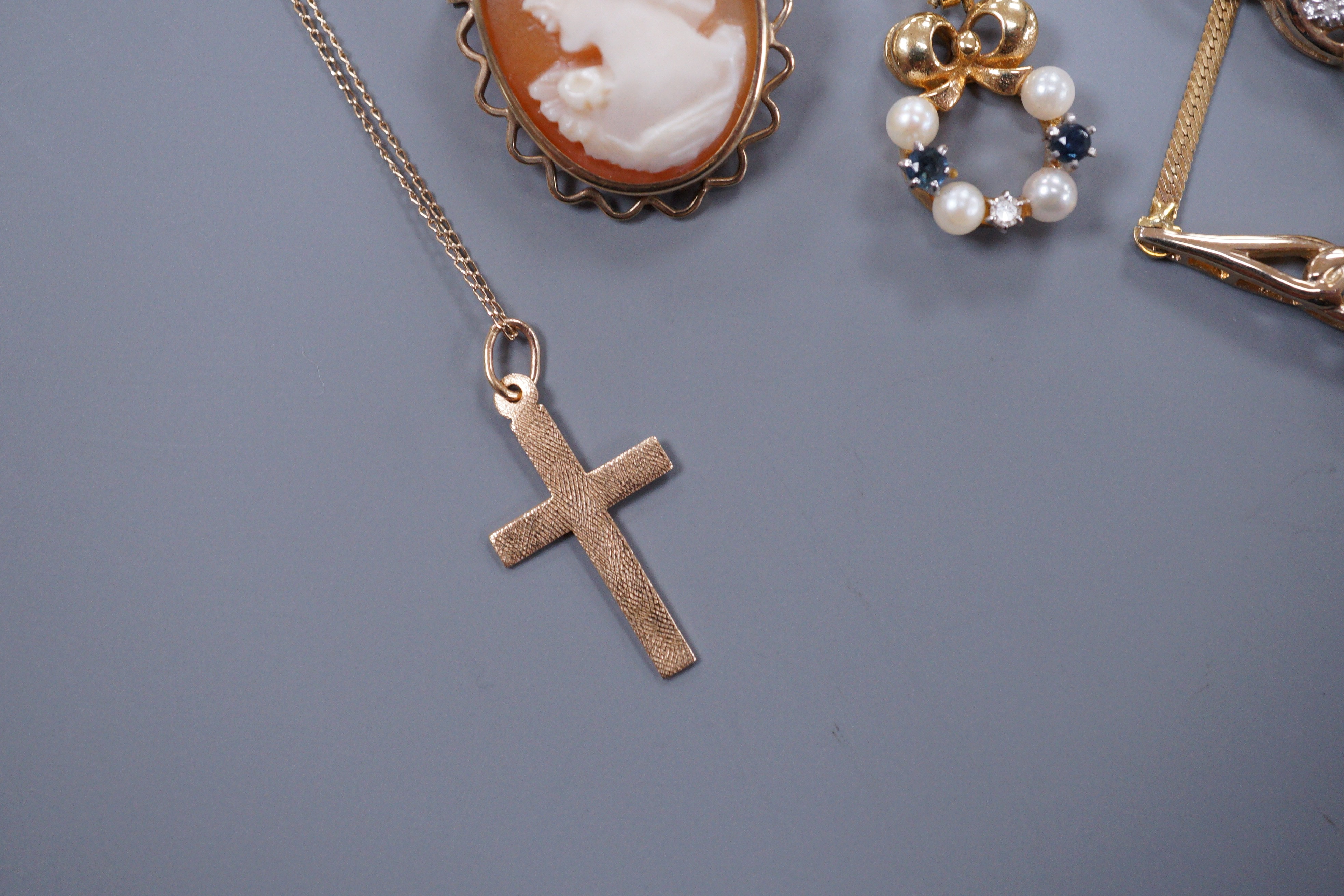 A 9ct gold diamond chip set necklace and matching bracelet, a cross pendant, a sapphire diamond and pearl pendant and a small cameo brooch, gross 11 grams